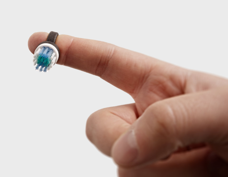 TinyBrush brush bristle on fingertip